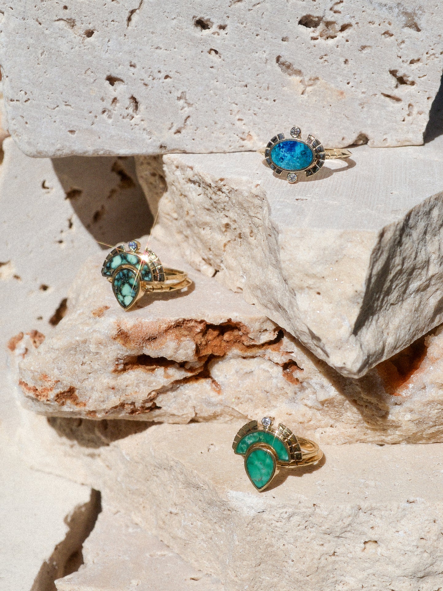 RISING SOL ARCH CROWN / The inlaid Broken Arrow turquoise is hand cut and shaped to fit perfectly inside this 14K gold bezel. A Young in the Mountain signature carved halo features a .03 ct conflict-free white diamond that brings beautiful light to this piece