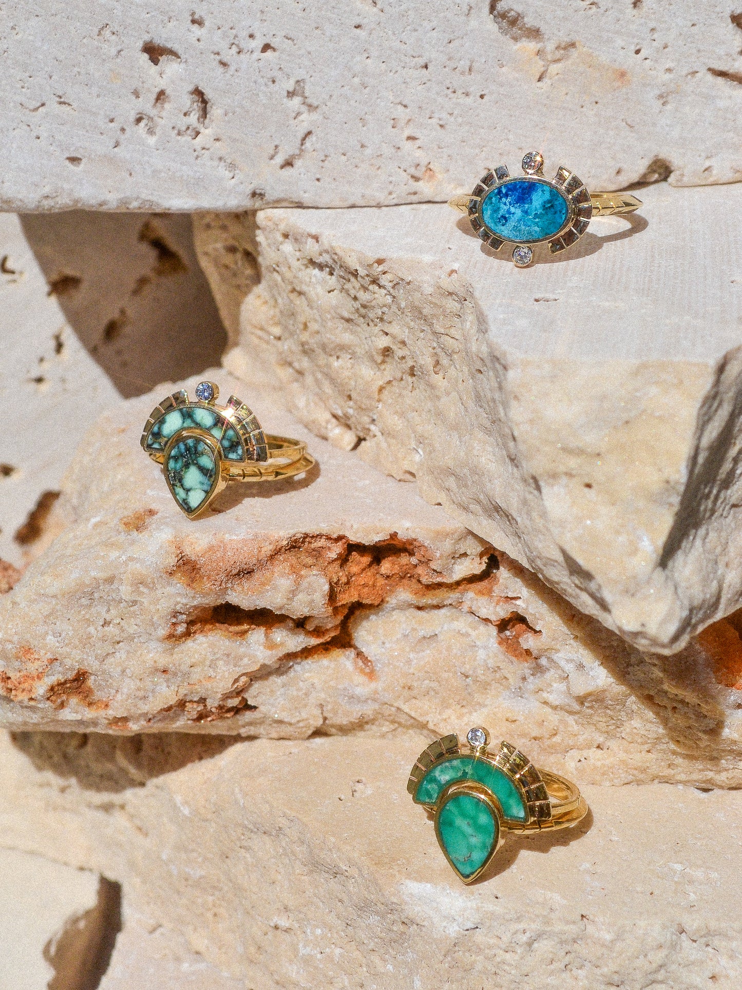 young in the mountains / The Sol Ring features inlaid shattuckite and is a beautiful and classic Young in the Mountains style. The Sol ring features two .03 ct. reclaimed white diamonds bezel set in 14k gold at top and bottom with golden wings at each side.