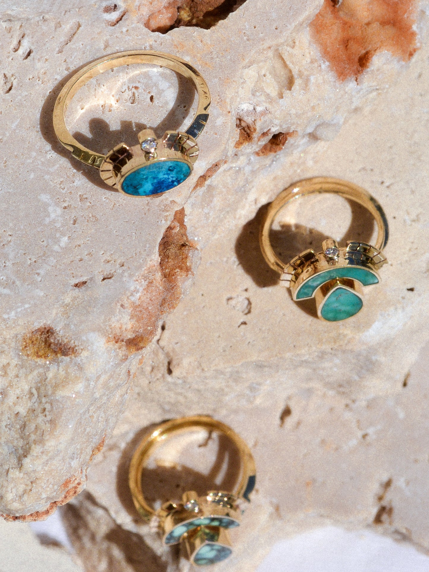 young in the mountains / The Sol Ring features inlaid shattuckite and is a beautiful and classic Young in the Mountains style. The Sol ring features two .03 ct. reclaimed white diamonds bezel set in 14k gold at top and bottom with golden wings at each side.