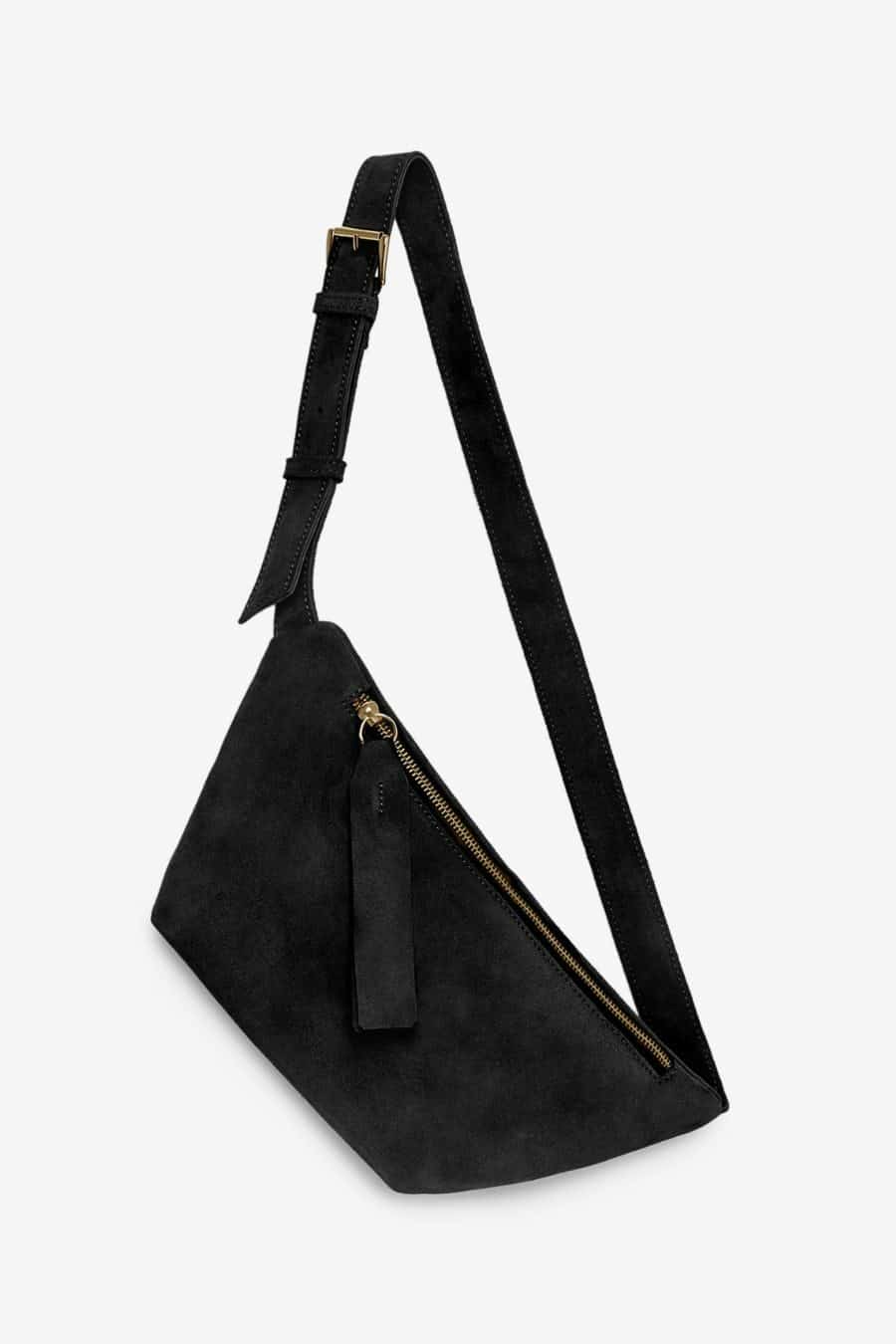 A suede bum bag style purse with an adjustable strap to go with you wherever and everywhere. The leather used to create this bag is completely abuse free. Ethically made in Portugal. Rita Row sold at Thread Spun.