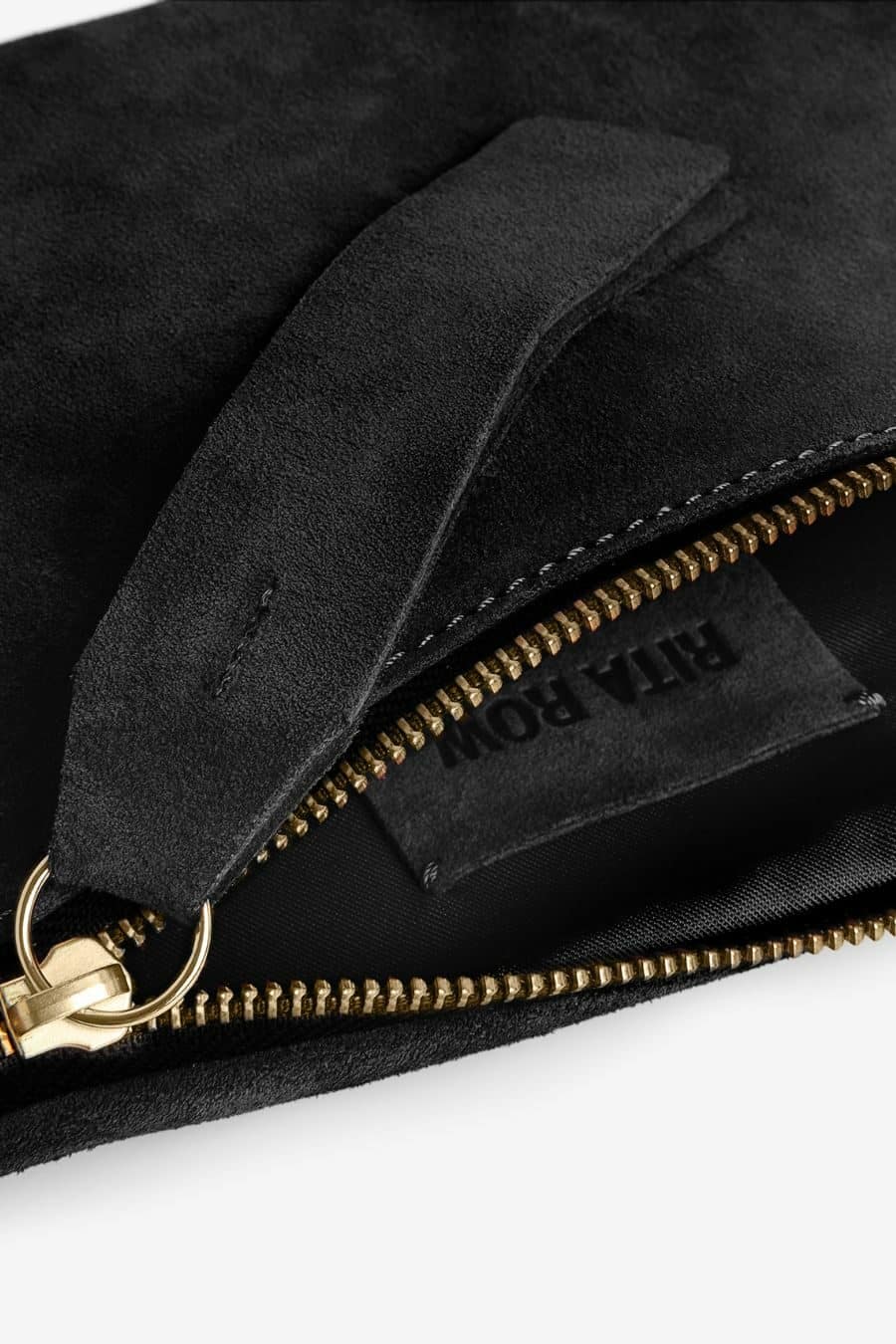 A suede bum bag style purse with an adjustable strap to go with you wherever and everywhere. The leather used to create this bag is completely abuse free. Ethically made in Portugal. Rita Row sold at Thread Spun.