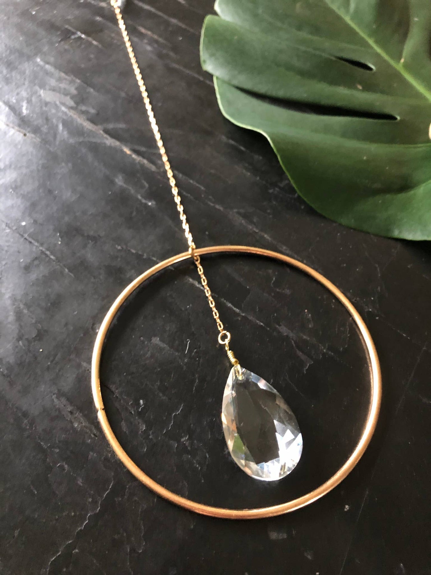 Artisan-crafted light catcher made from brass tubing and 2 vintage faceted crystals. Ready to hang in any space in your home - on a wall to brighten or in a window to catch the light.