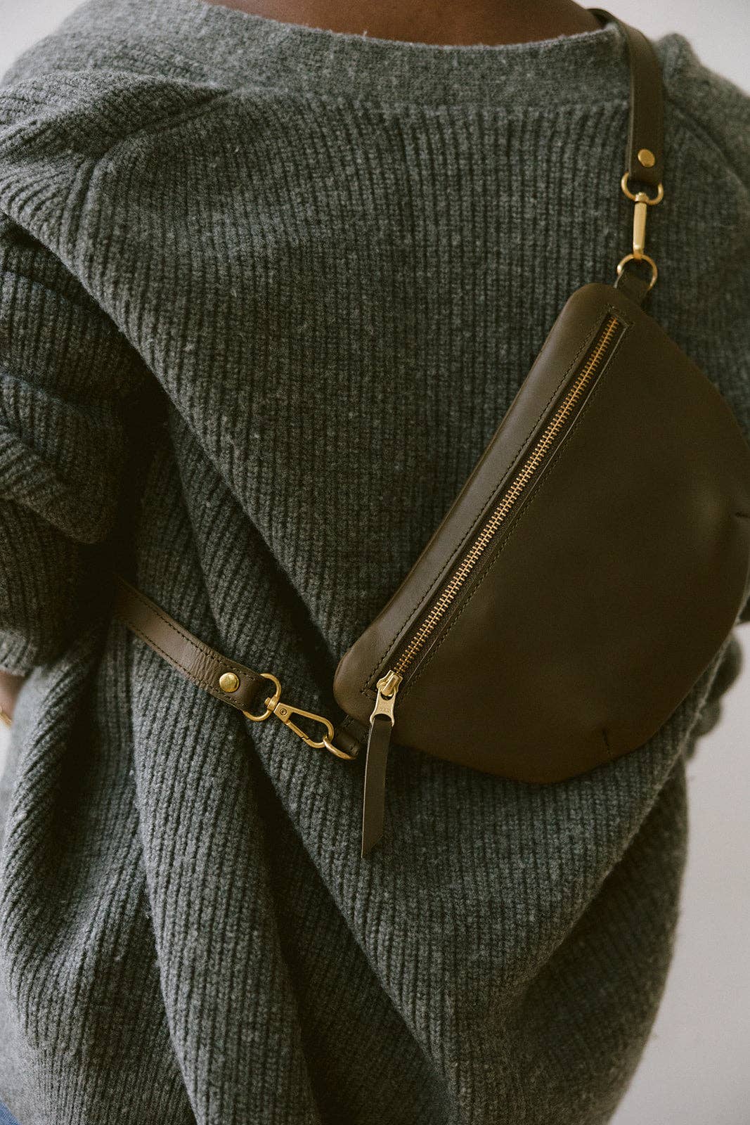 Fair trade and adjustable leather sling bag/fanny pack. Adjust the length to fit your needs. Handcrafted, vegetable tanned leather sling bag made in Kenya with locally and ethically-sourced materials. A portion of sales go to an organization in Tanzania empowering children living on the street.