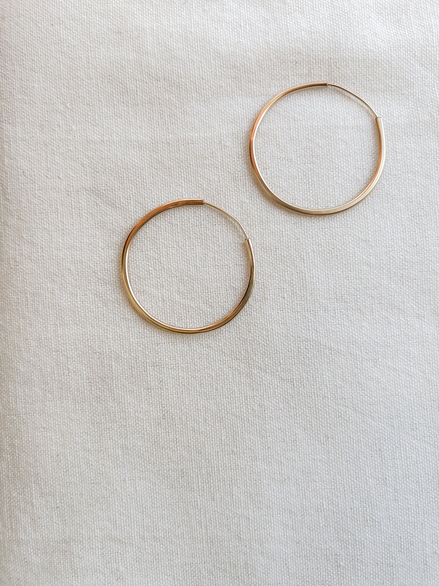 Simple, thin gold hoops that one can wear for any occasion.