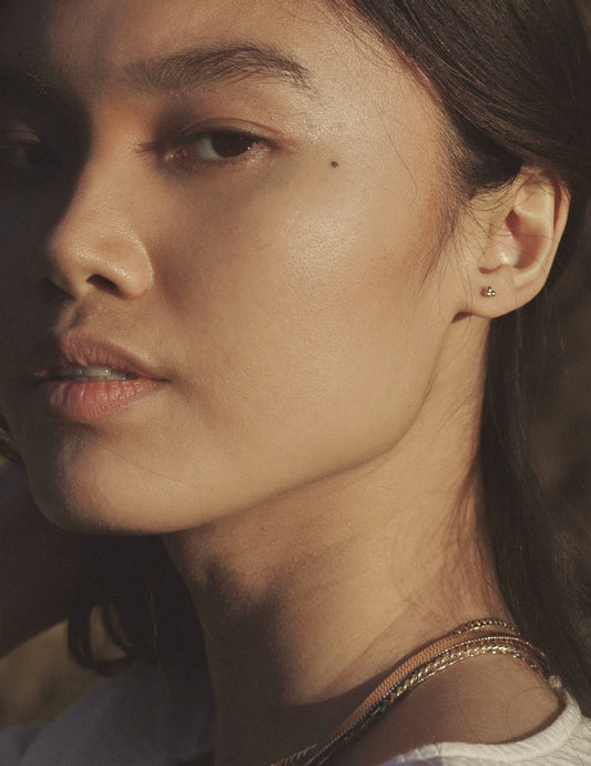 A simple tiny delicate cluster stud earring inspired by sandy shores and pebbles along the path. Handmade in the Santa Cruz Mountains.