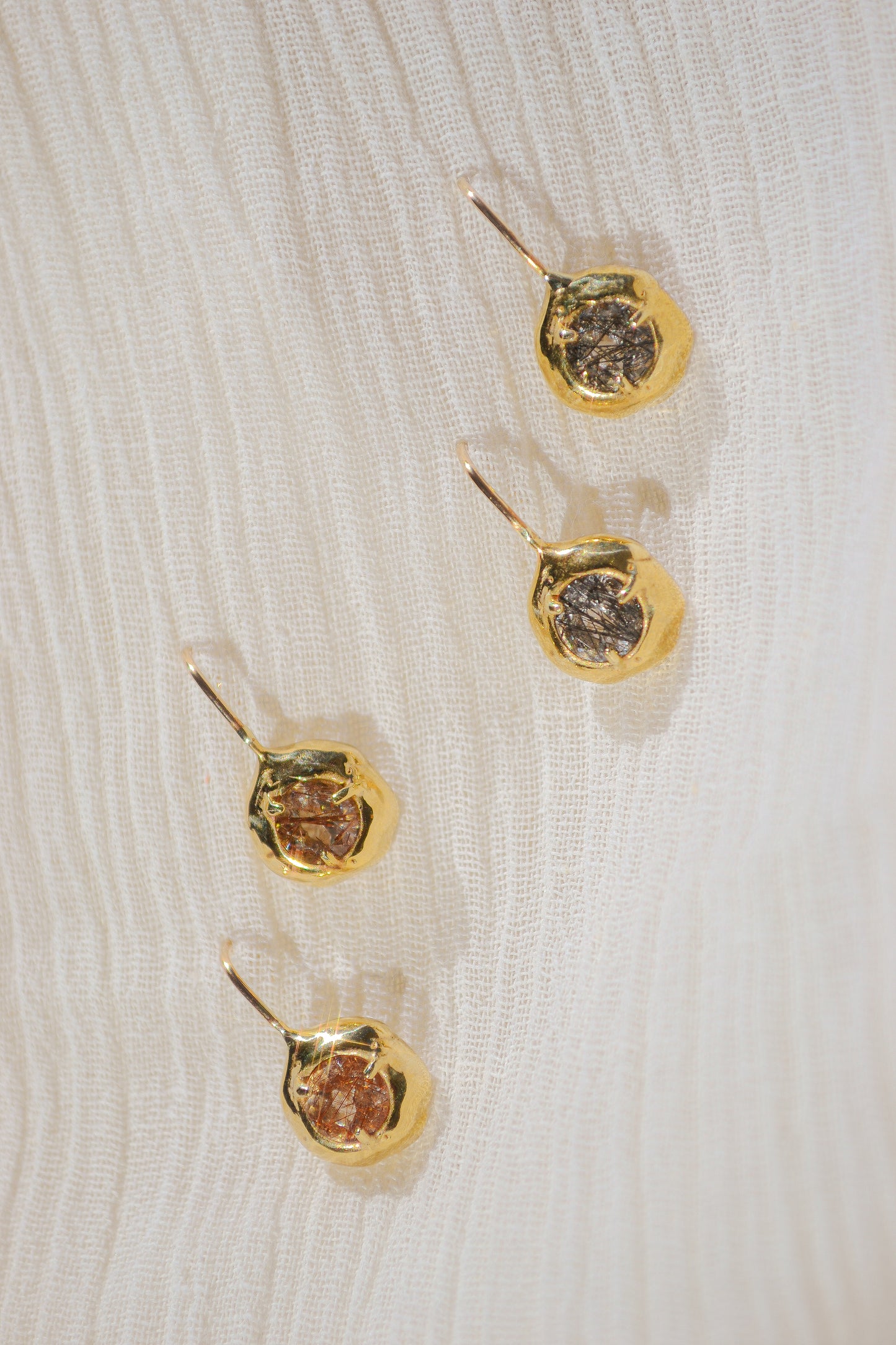Delicate quartz pendant earrings handmade in northern California by Amanda Hunt. Keep the energy of quartz close to you.