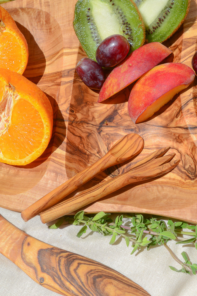 Made by hand in Tunisia with olive trees that had finished producing olives. Cute mini forks can stab, grab and pick up any tasty snack. Perfect for olives, cheese, fruits and more!