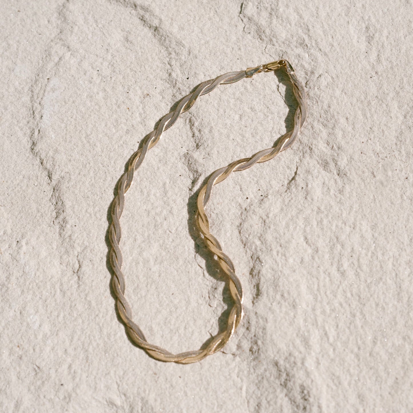 Kalia Necklace by Mountainside Jewelry. A dramatic flat textured twisted chain necklace with fine braided detail - an elegant addition to any style, designed to be dainty and delicate as well as bold and fierce, this piece was crafted by hand with love and care. Handmade in the Santa Cruz Mountains.