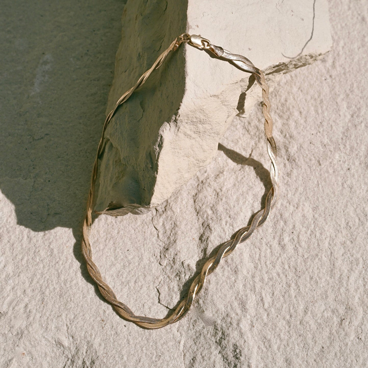 Kalia Necklace by Mountainside Jewelry. A dramatic flat textured twisted chain necklace with fine braided detail - an elegant addition to any style, designed to be dainty and delicate as well as bold and fierce, this piece was crafted by hand with love and care. Handmade in the Santa Cruz Mountains.