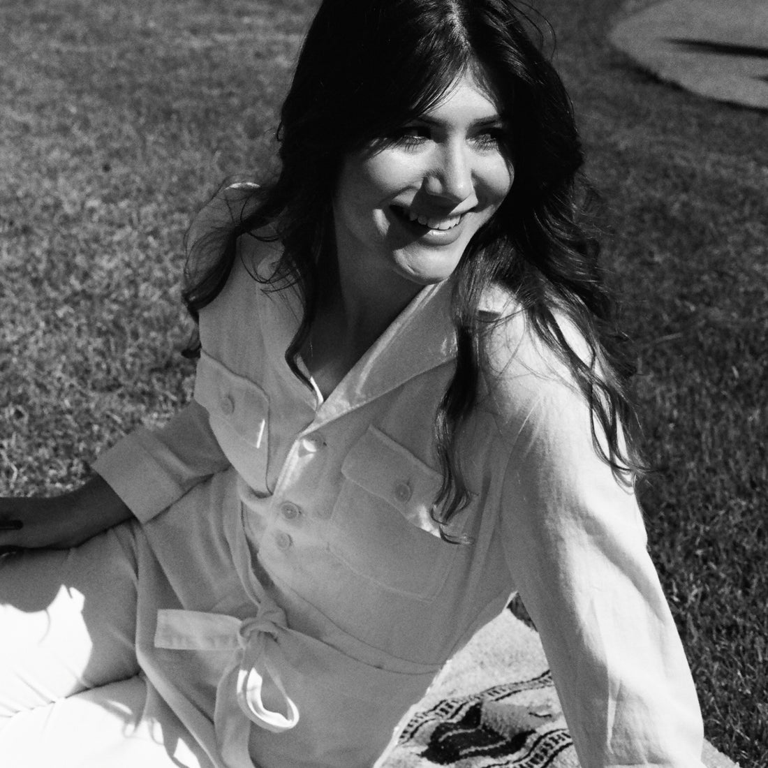 Local Leucadia artist Jamie Jones wearing a sustainable Outerknown jumpsuit by local women's boutique Thread Spun
