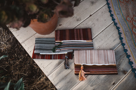 Handmade clutches by Thread Spun feature artisan textiles and environmentally-friendly materials