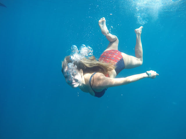 Blogger Devon DeMint swims in the ocean.