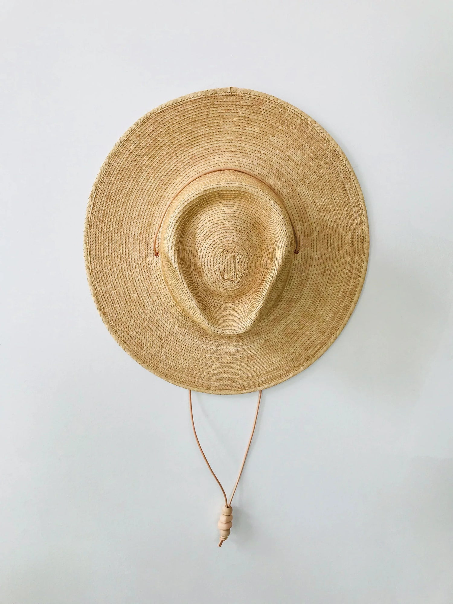 West Perro natural palm leaf hat with chin strap and handmade clay bead