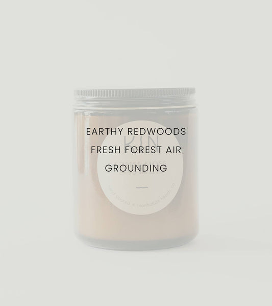 Forest Moss Candle by Kin Candle Co. Grounded and vivacious. Like wandering an earthy trail under the canopy of ancient Big Sur redwoods. This scent is a breath of fresh air, reconnecting the mind with the natural world with scent notes of Amber, Redwoods, and Citrus.