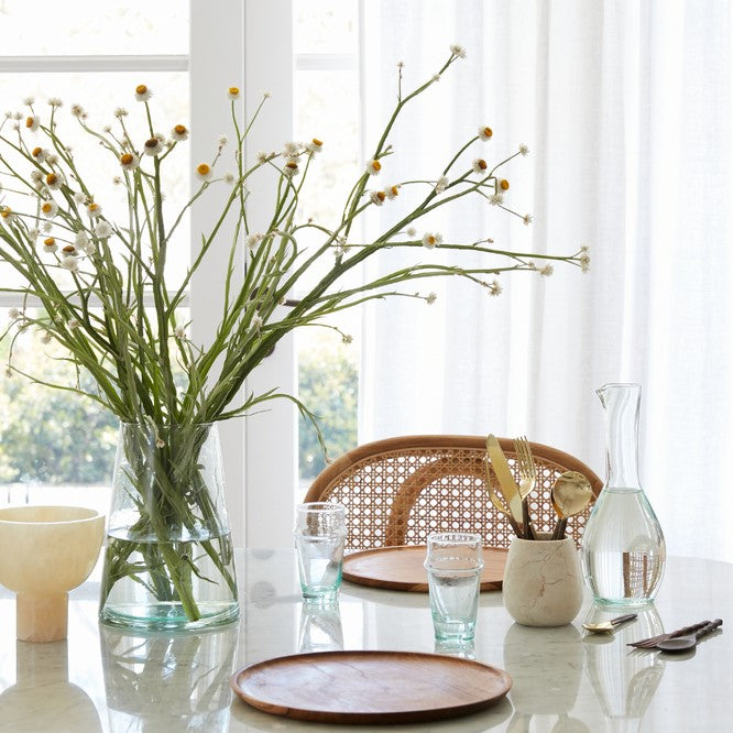 Simple and elegant, the Carafe Bouteille Cigogne is an elegant statement on any tabletop. Perfect for hosting family and friends or used as a vase. Handblown in morocco using local recycled glass, giving these materials another life. 
