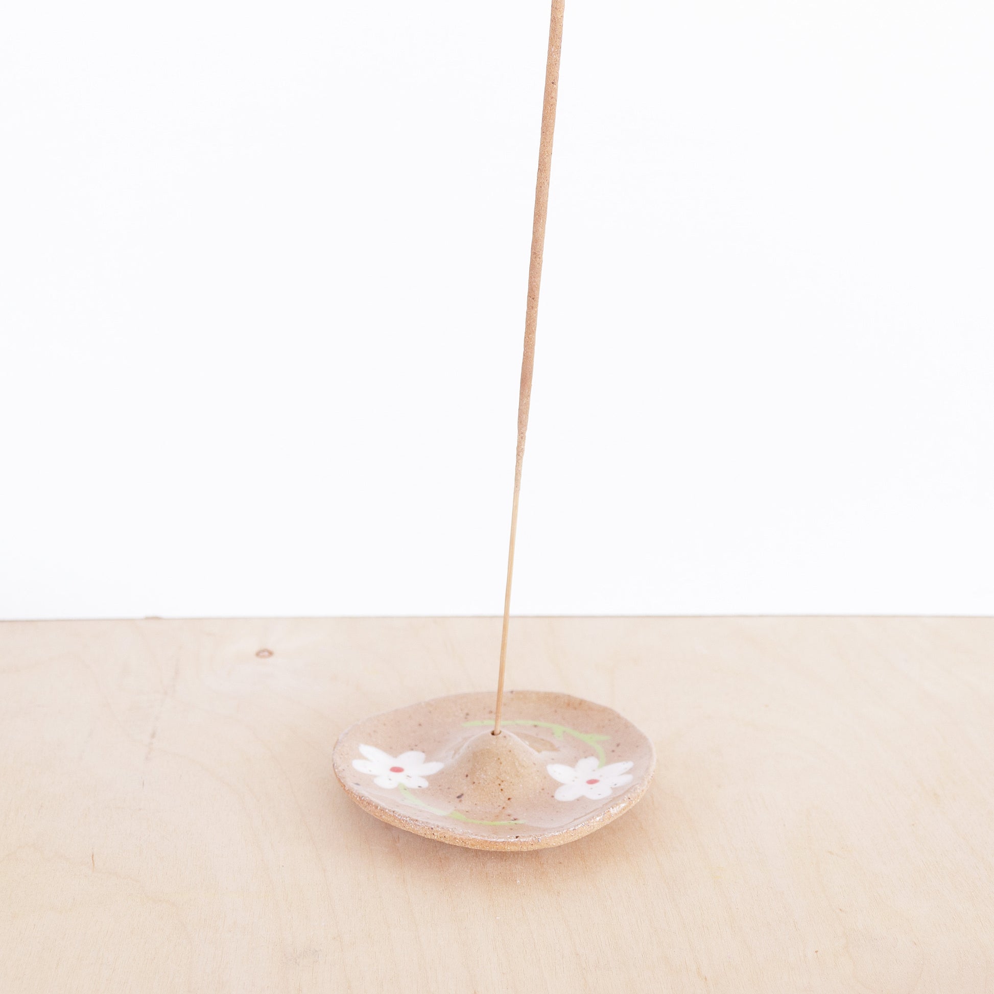 nightshift ceramics - Modern, minimalist incense holder. Hand formed from speckled stoneware and finished with daisy illustration and clear glaze.