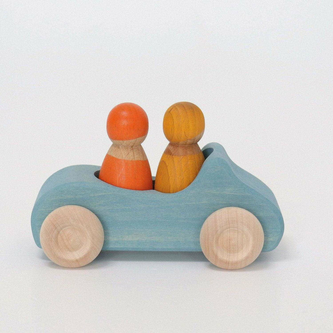 A large convertible car in blue with two peg friends by Grimms.