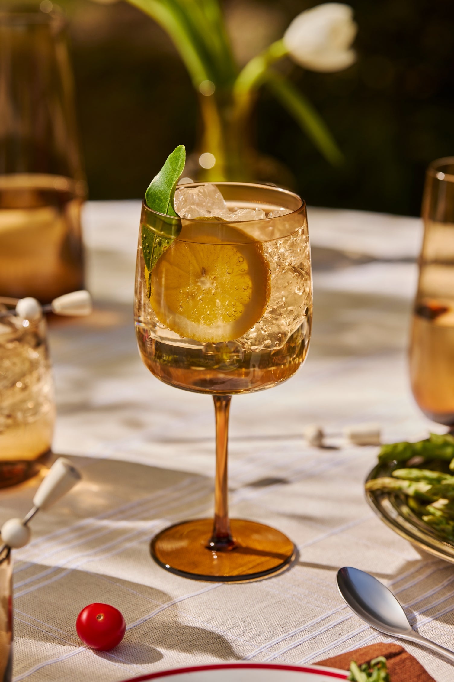 A modern wine glass rendered in thin, colored mouth blown glass with a clean, balanced form. Suited for both red and white wines, adding depth and character to casual or formal settings.