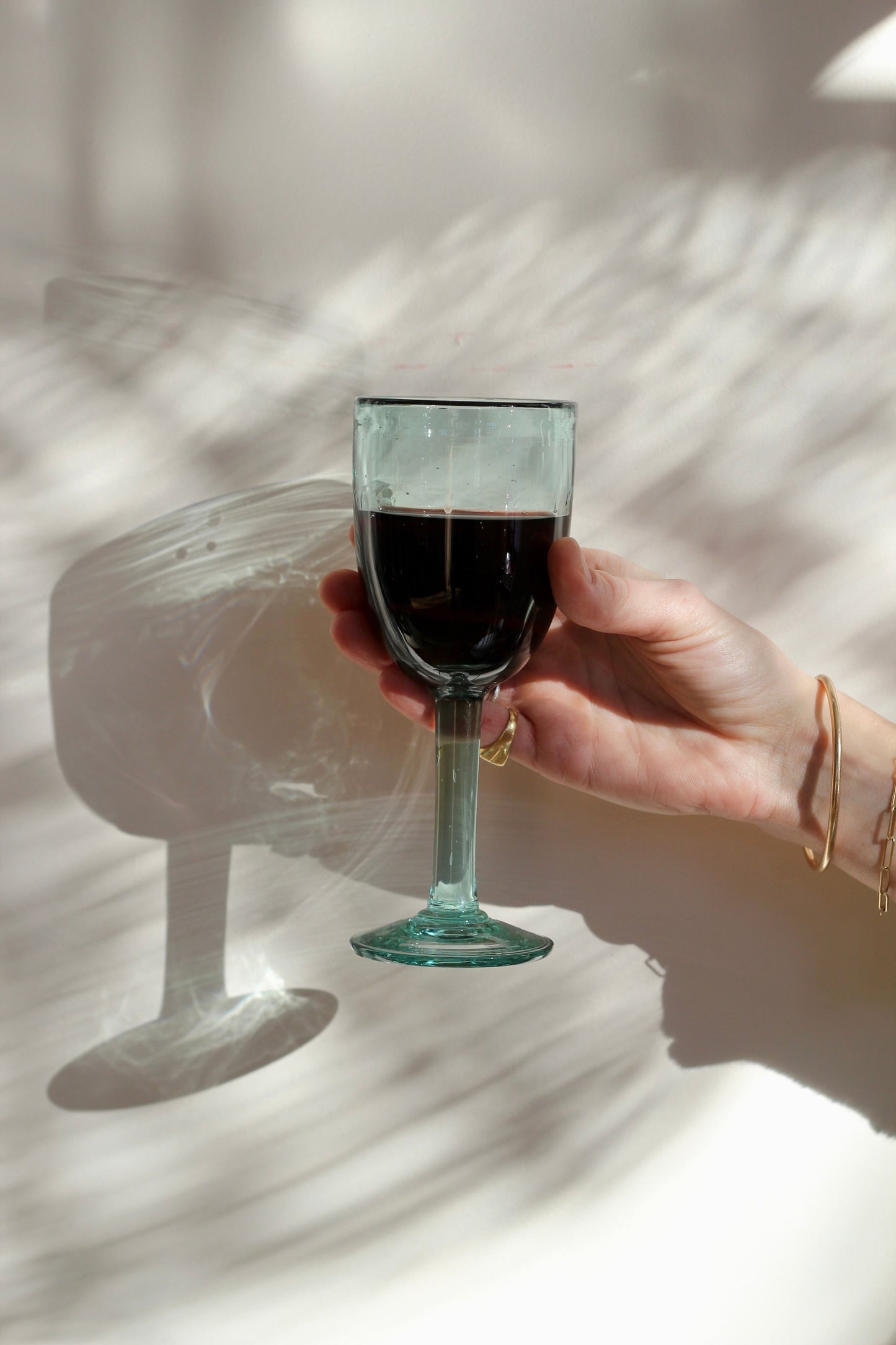 A funky, one-of-a-kind wine glass designed to bring character to any table. With its distinctive handmade feel, this stemmed glass adds a fun touch to serving wine. Each piece is handblown with recycled glass by artisan partners in Bogotá, Colombia.