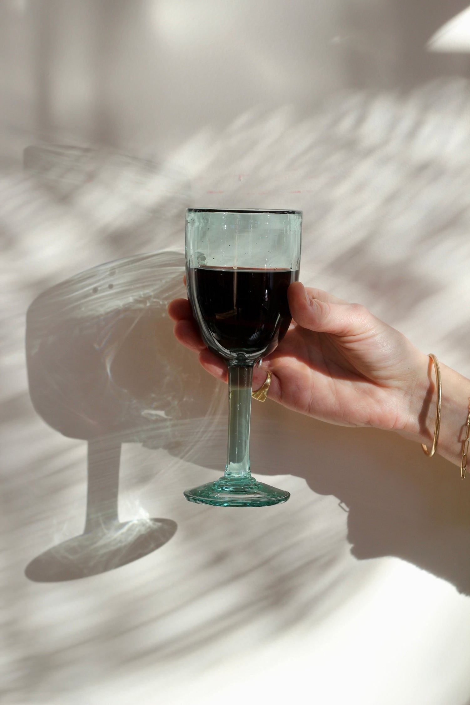 A funky, one-of-a-kind wine glass designed to bring character to any table. With its distinctive handmade feel, this stemmed glass adds a fun touch to serving wine. Each piece is handblown with recycled glass by artisan partners in Bogotá, Colombia.
