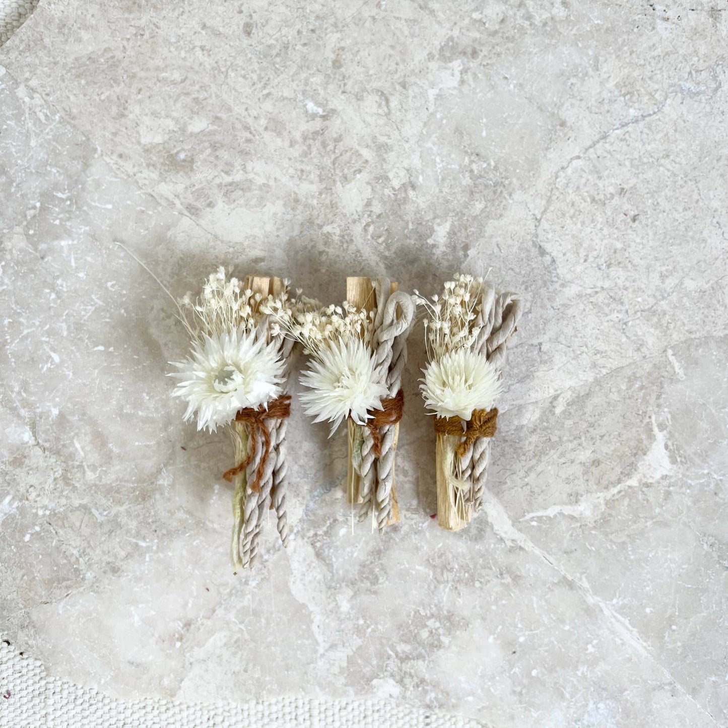 Palo santo bundle with bleached starflowers, a pretty strawflower and three rope incense braids, all wrapped with vintage string. These all white, neutral bundles are limited edition. Perfect for the first snow fall and winter solstice. / solstice moon bundle by catherine rising