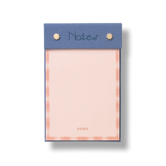 Papier's fabric notepad brings a tactile twist to everyday list-making.

Wrapped in a textured fabric cover, it’s a space to elevate quick notes, reminders, and daily to-dos into something more considered.