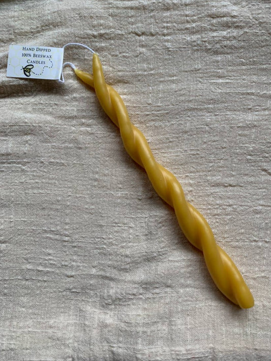 Hand dipped layer by layer and twisted with care, 100% beeswax taper candles. 9" long with a burn time of 3 hrs. Hand dipped taper candles burn longer, with greater integrity and less drip than tapers formed by pouring into molds.