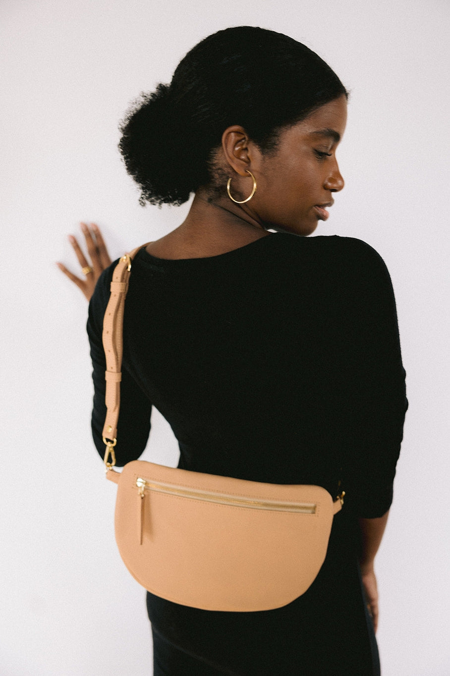 The best-selling Sling Bag is now available in a bigger size. Still sleek, lightweight, and chic, now you'll be able to add that *one* extra thing. Your large wallet, glasses case, or even a small book will fit inside the Big Sling. Fair trade and adjustable leather sling bag/fanny pack.