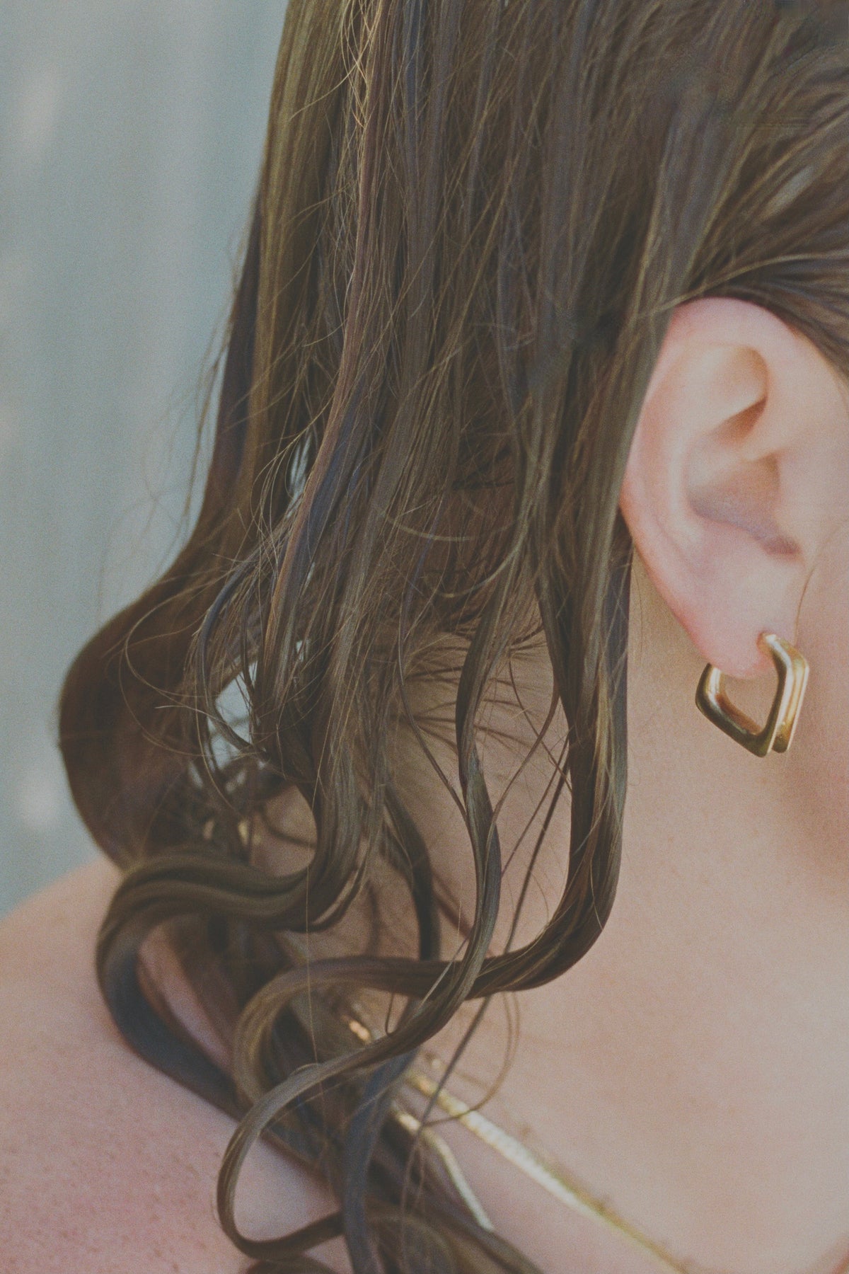 Convex, organic and simple geometric hoop earrings.