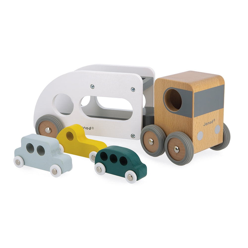This big wooden car transporter truck, with a detachable trailer, can deliver 3 cars at a time. It will go everywhere thanks to its large steering angle. The transporter has rubber wheels, which are perfectly silent. 3 cars included. Develop your child’s imagination and fine motor skills. Made from solid FSC TM wood and water-based paint.