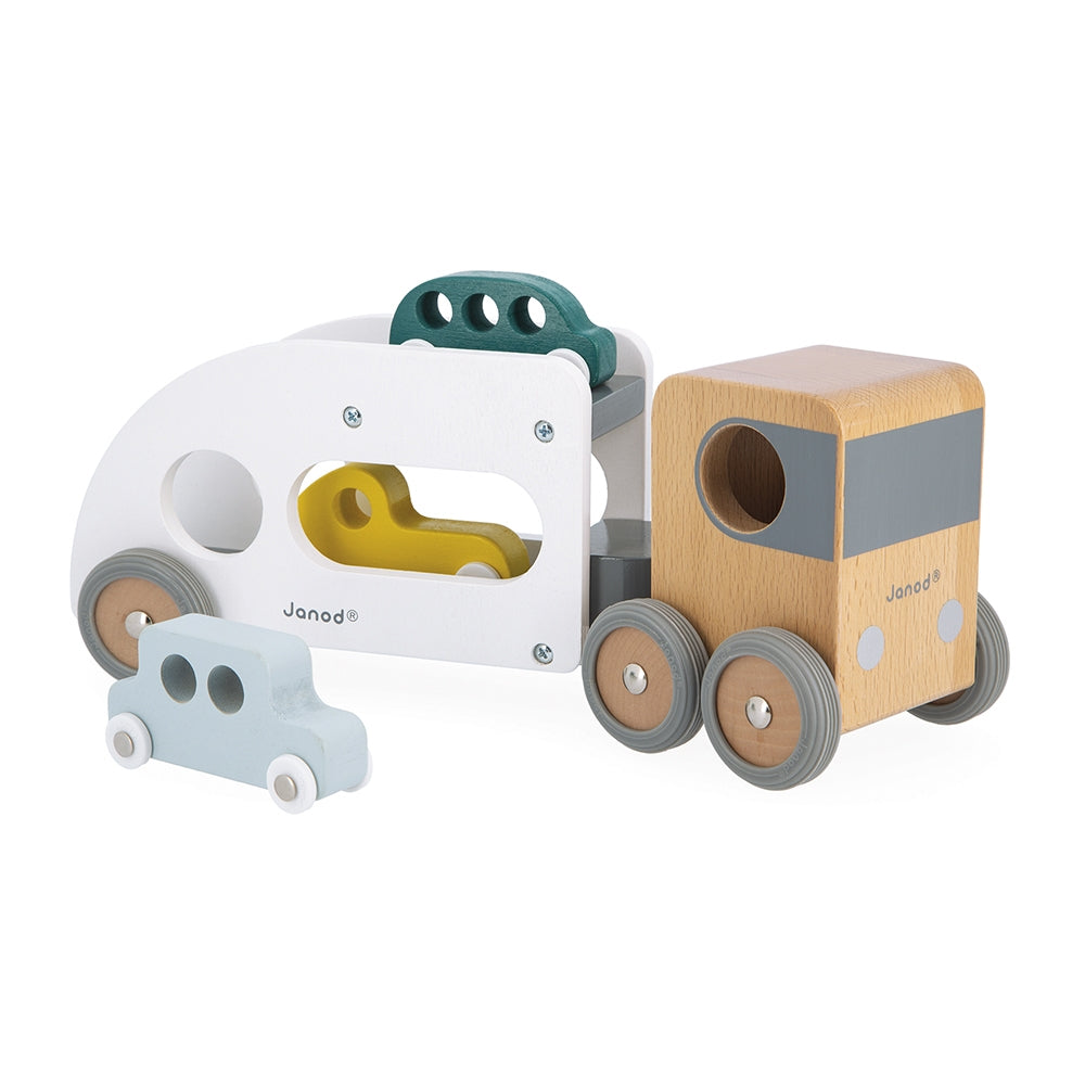 This big wooden car transporter truck, with a detachable trailer, can deliver 3 cars at a time. It will go everywhere thanks to its large steering angle. The transporter has rubber wheels, which are perfectly silent. 3 cars included. Develop your child’s imagination and fine motor skills. Made from solid FSC TM wood and water-based paint.