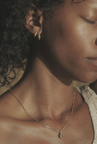 Mountainside Siempre Earrings - Asymmetrical mythical mystical hoop earrings for anytime and anywhere. Inspired by the curvature of a slowly growing vine. Intended to curve around the ear for a unique illusion. Handmade in the Santa Cruz Mountains.