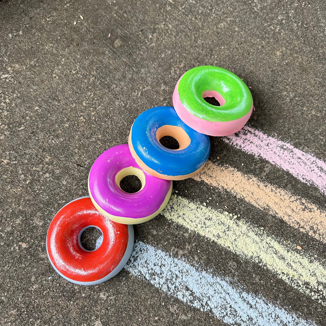 Grab one of these hand painted donuts for outdoor fun this season! With acrylic paint on top of vibrant colored chalk, you are sure to create something unique and special! Eco-friendly, non-toxic, washable.