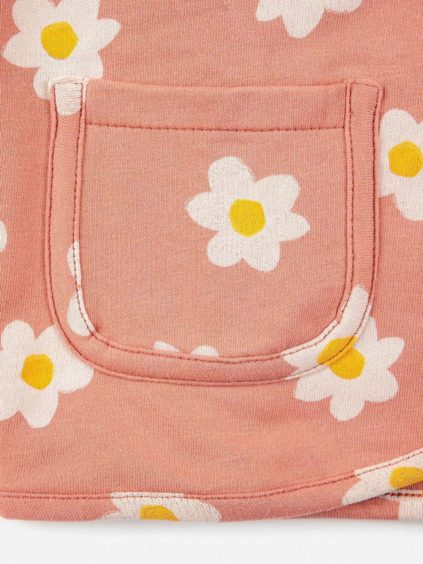Bobo Choses Baby Little Flower Buttoned Sweatshirt - 95% organic cotton 5% elastane salmon pink sweatshirt. Designed with long sleeves, dropped shoulder, front snap fastening, lining and patch pocket. It has a loose fit. Made in Portugal.