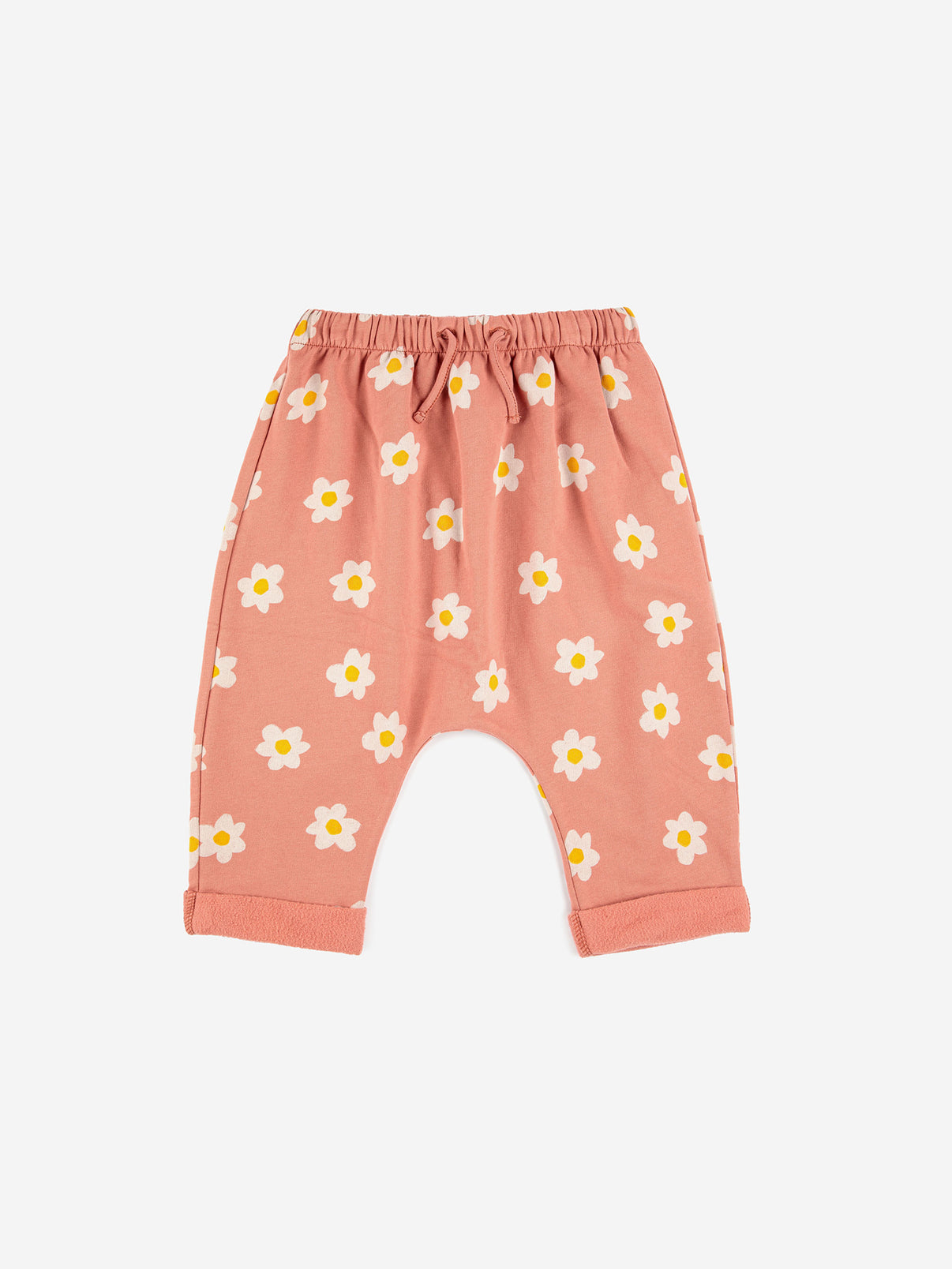 Bobo Choses Baby Little Flower All Over Pants - 95% organic cotton 5% elastane salmon pink trousers. Designed with adjustable waistband and turn up hem. It has a baggy fit. Made in Portugal.