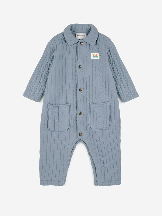 Bobo Choses Baby Quilted Overalls - 78% cotton 22% polyester blue overall. Designed with spread collar, front snap fastening, crotch snap fastening, patch and patch pocket. It has a relaxed fit. Made in Portugal.