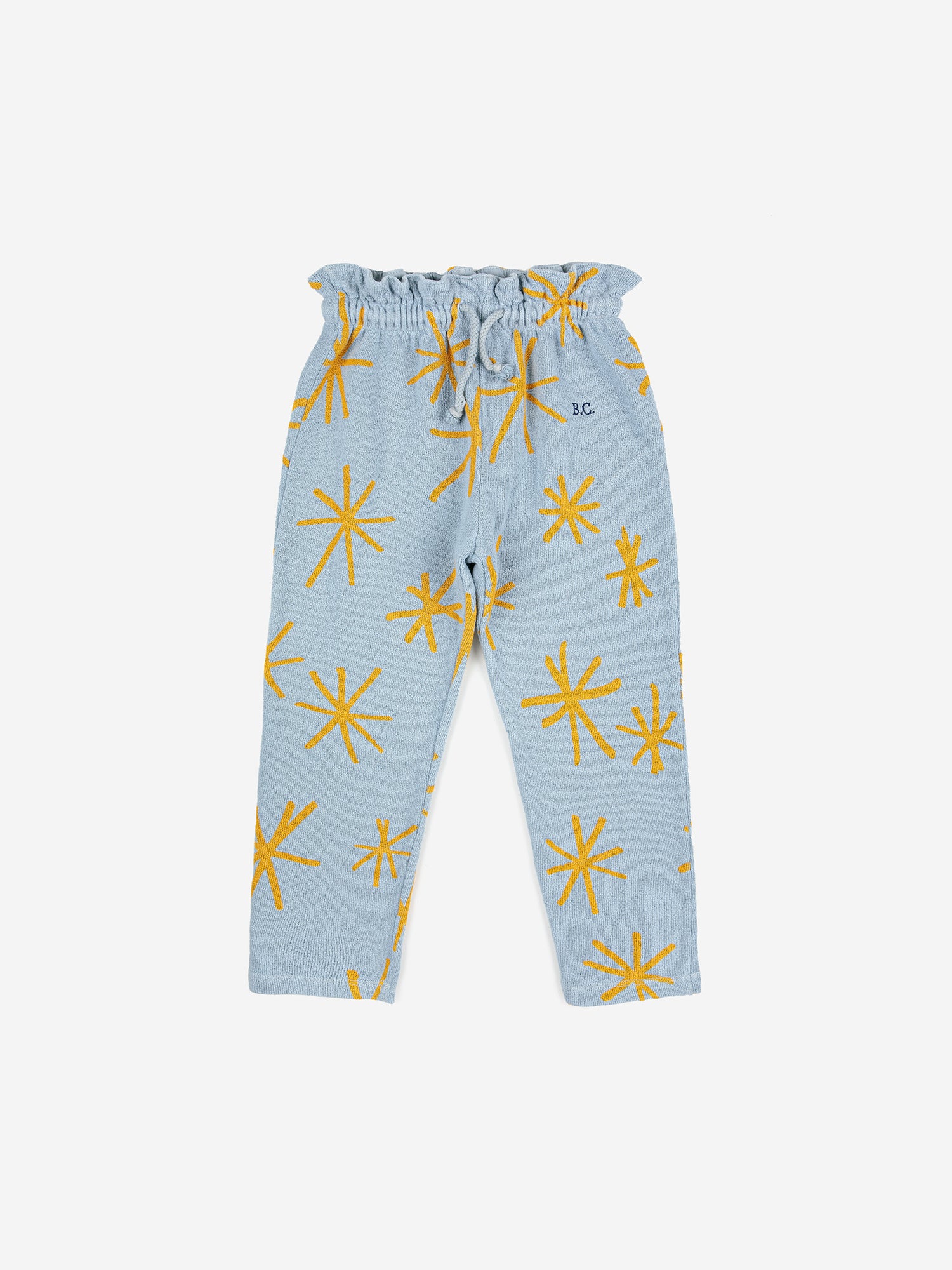 Sparkle Jogging Pants by Bobo Choses. 100% BCI cotton powder blue jogging pants with yellow sparkle print. Designed with adjustable ruffled waistband, ankle length and sooo soft inside. It has a baggy fit.   Made ethically and sustainably in Portugal for Bobo Choses.