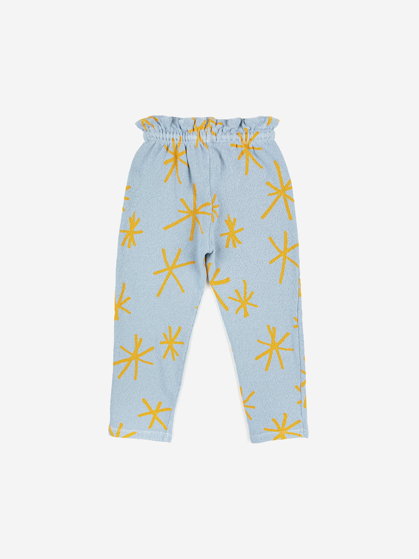 Sparkle Jogging Pants by Bobo Choses. 100% BCI cotton powder blue jogging pants with yellow sparkle print. Designed with adjustable ruffled waistband, ankle length and sooo soft inside. It has a baggy fit.   Made ethically and sustainably in Portugal for Bobo Choses.