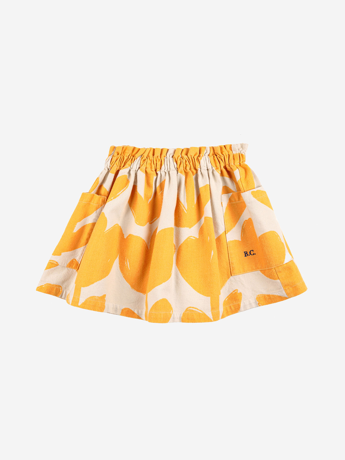 Big Flowers Woven Skirt by Bobo Choses. 100% cotton off white knee length skirt. Designed with elasticated waistband, patched side pocket, embroidery and over knee length. Made ethically and sustainably in Spain for Bobo Choses.