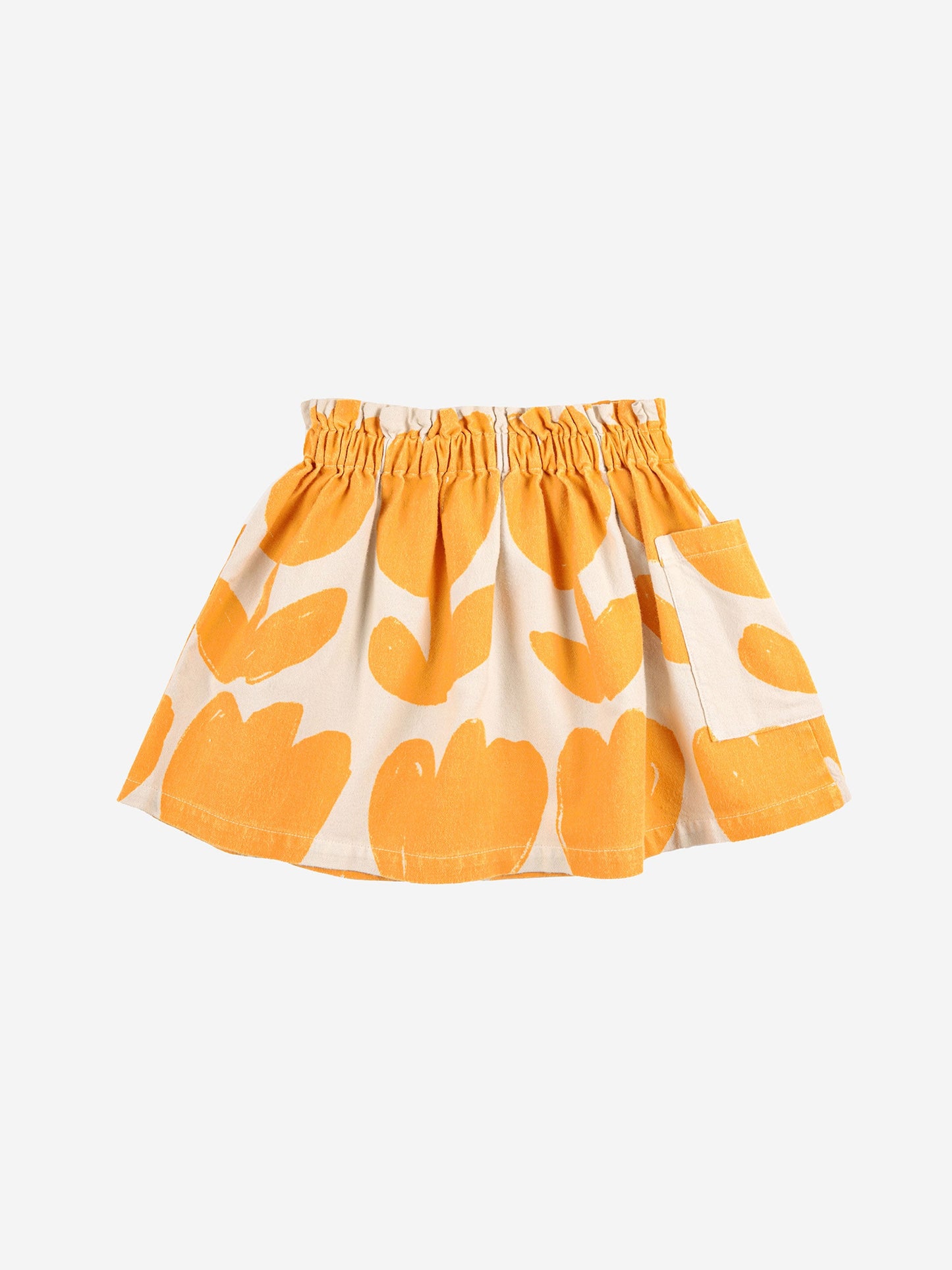 Big Flowers Woven Skirt by Bobo Choses. 100% cotton off white knee length skirt. Designed with elasticated waistband, patched side pocket, embroidery and over knee length. Made ethically and sustainably in Spain for Bobo Choses.