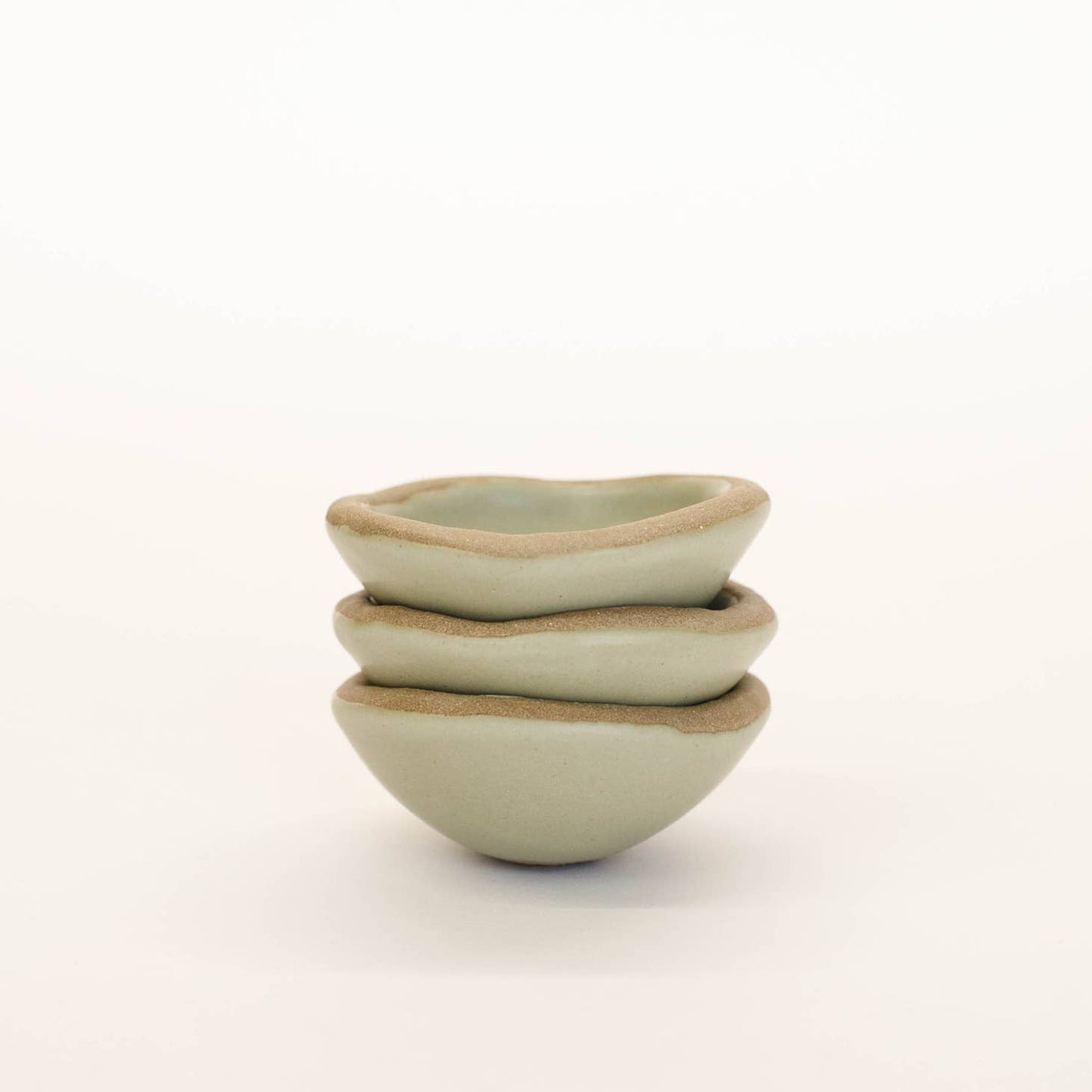 This tiny ceramic dish is small but mighty! Multi-purpose and incredibly durable, made of stoneware clay. For q-tips in the bathroom, bedside for jewelry, or in the kitchen for spices - This dish functions best when there is at least one in every room of a home!   Handmade in Virginia
