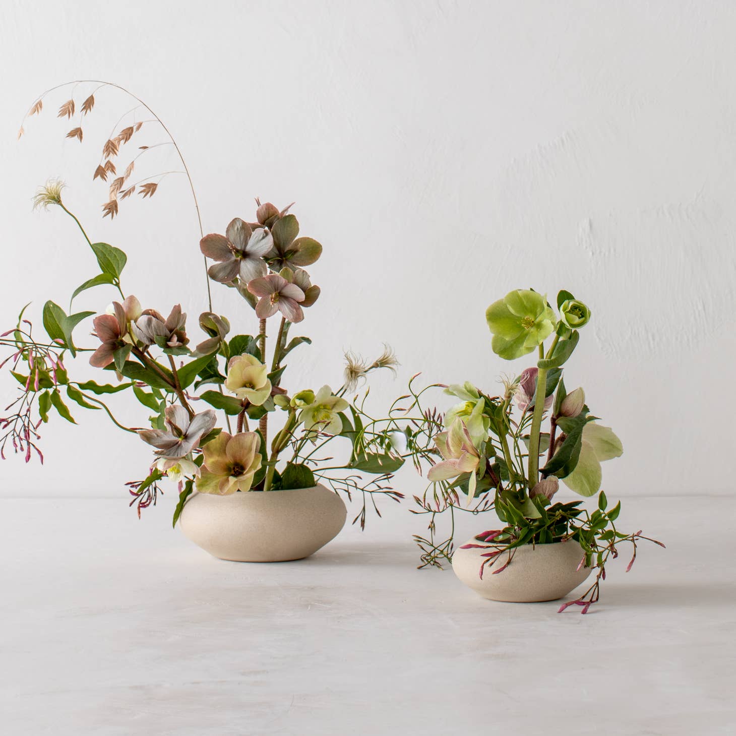 convivial ikebana vase no 1 / Slow down and enjoy the subtle beauty of nature with a handmade ceramic ikebana vase. This round, shallow vase is designed for minimal, ikebana inspired arrangements. Handmade with proprietary sandstone with an ivory glaze on the interior.