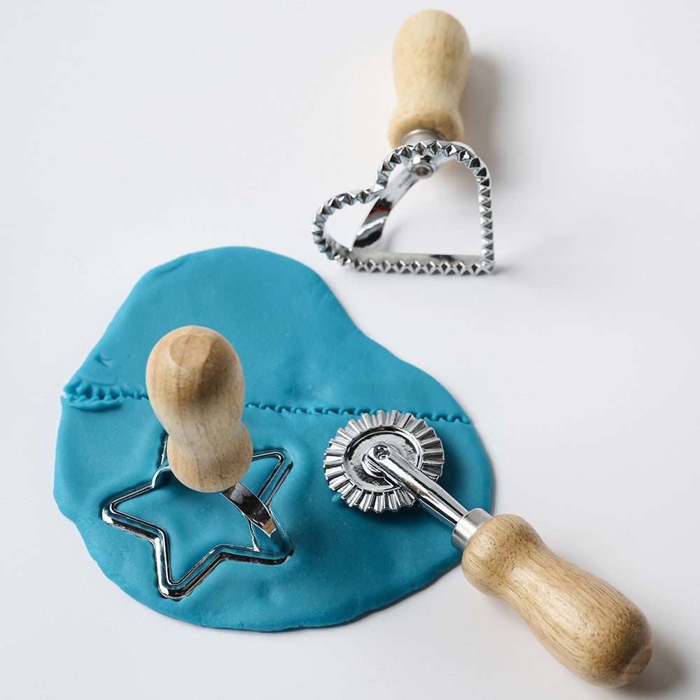 These kid-safe eco-dough tools have no harmful sharp edges but cut through dough with ease. Make star and heart shaped “cookies” or use the cutting wheel to create free-form shapes. Inspire your child’s imagination while improving fine motor skills. No plastic parts, cleans with warm sudsy water.