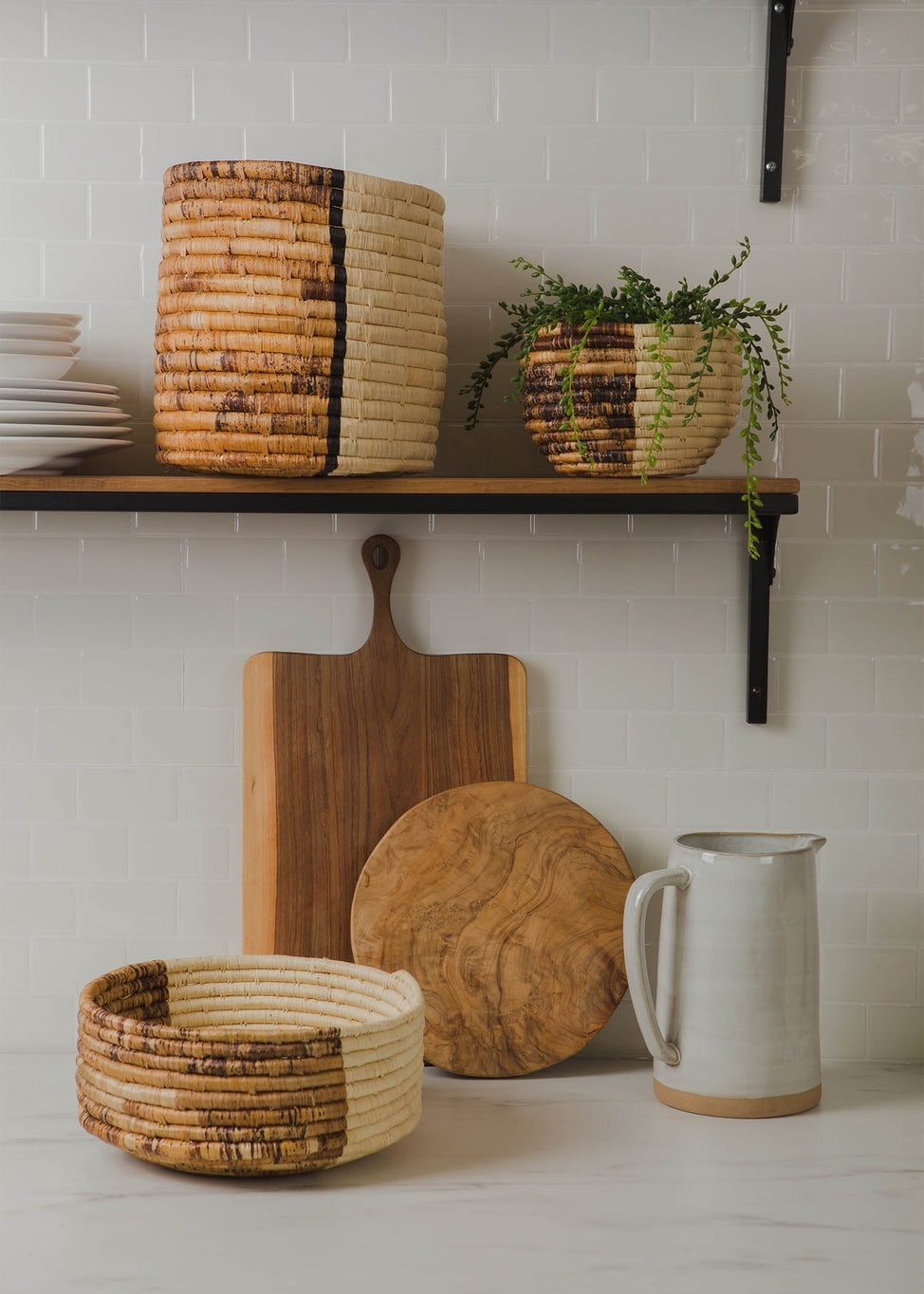 These chic home accessories can be beautiful accent decor in your home office or the perfect size for a deep fruit basket on your countertop. Handmade in Rwanda from all natural fibers of Raffia.