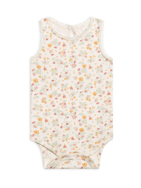 The sweetest staple with a touch of lace. The Luna tank bodysuit will be a go-to base layer that lasts well beyond summer vacation and is made with the softest organic cotton.  Naturally hypoallergenic with water based dyes.