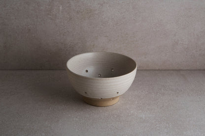 Ceramic colander is great for washing berries and small greens.