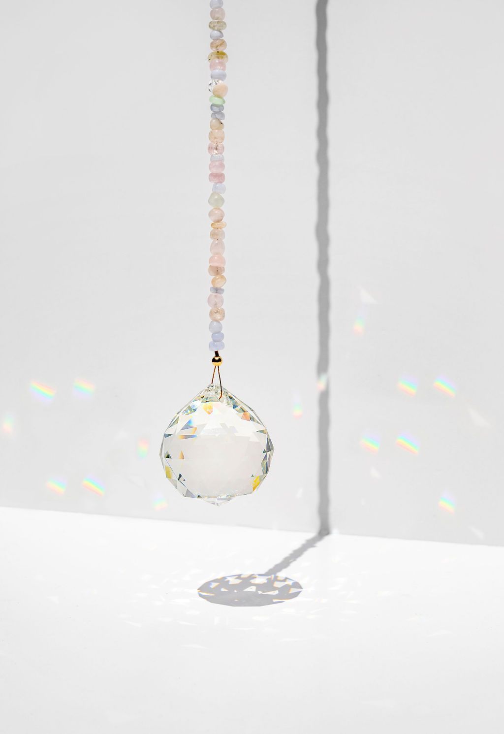 punkwasp by carrie marill window prism - Energize your space with a window prism - hang in a sunny spot & watch the rainbows dance!  Hanging Feng Shui window prisms within the home can balance the energy and activate a stale space :: freshwater pearls for an extra dose of harmony.