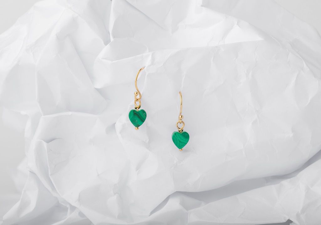 Malachite serves as a fiery protector of an open heart and restorative healer of a wounded heart - tiny talismans for your ears. Malachite Hearts on gold fill ear wires. Designed in California by Carrie Marill and made by hand in her SoCal studio.