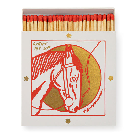 Matches with a horse illustration and 'Light Me Up' text on the packaging. Archivist Gallery Square Matches