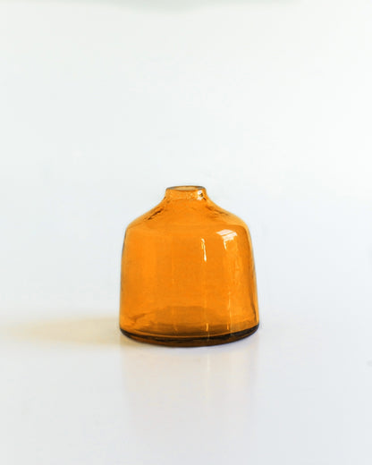 bella hammered glass bud vase . Ideal for showcasing a single bloom or a small bouquet, these bud vases bring a touch of subtle texture to any space while honoring a commitment to people and the planet.